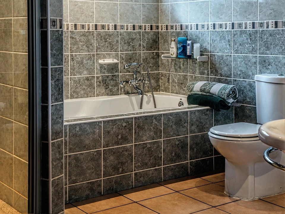 what is cheaper filing a bathroom or using panels